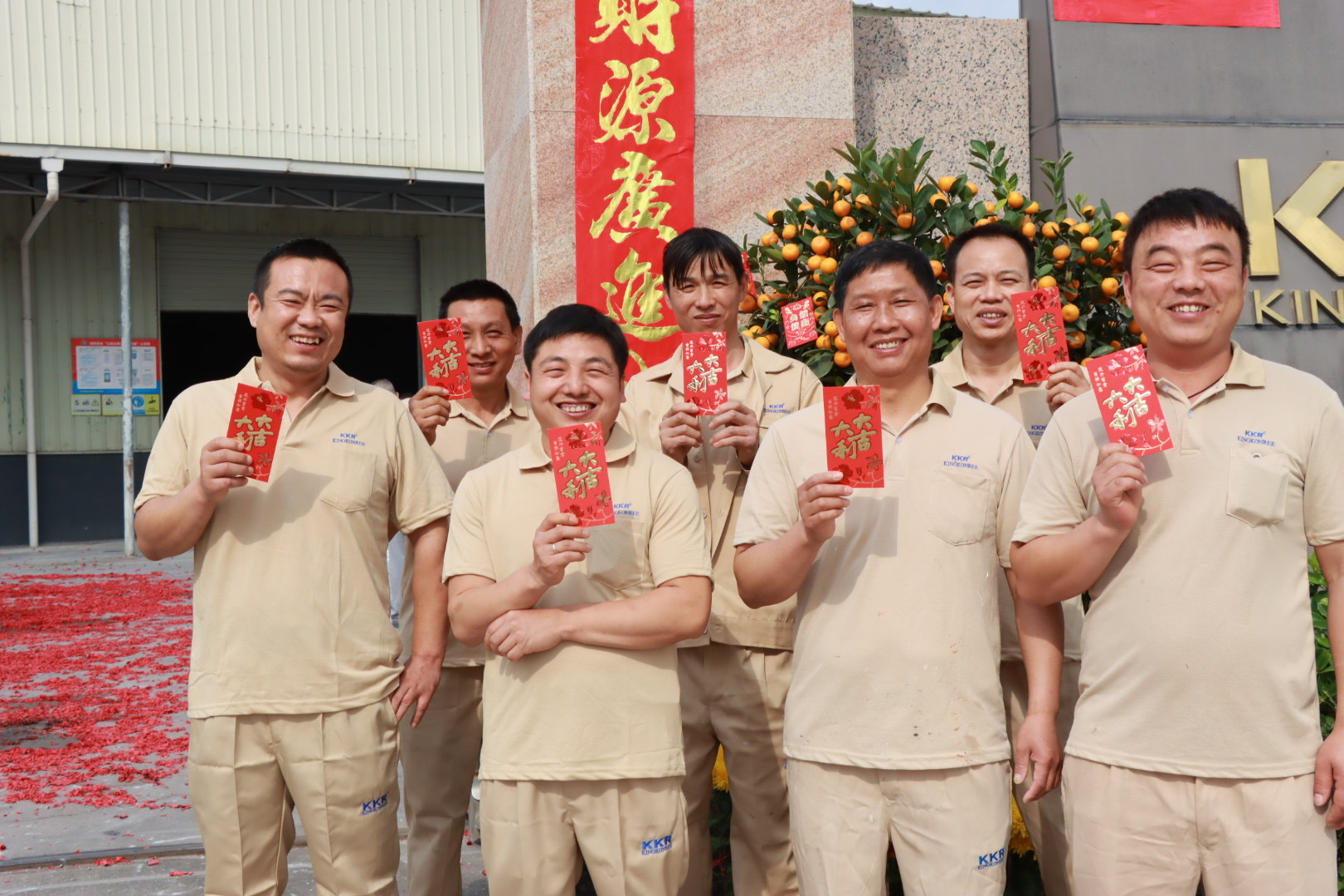the workers smiled happily when they received red envelopes
